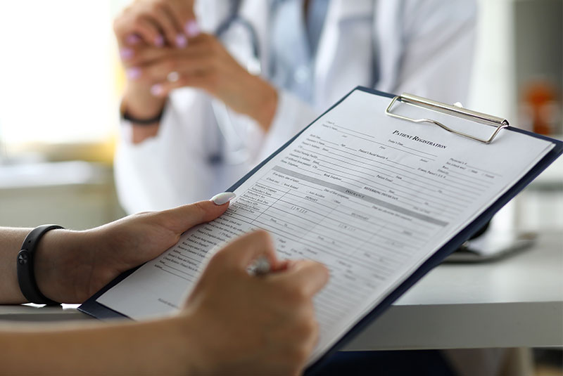 dental patient filling out forms
