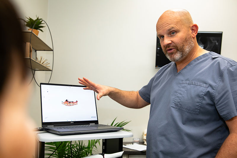 Dr. Carey explaining zirconia fixed bridges